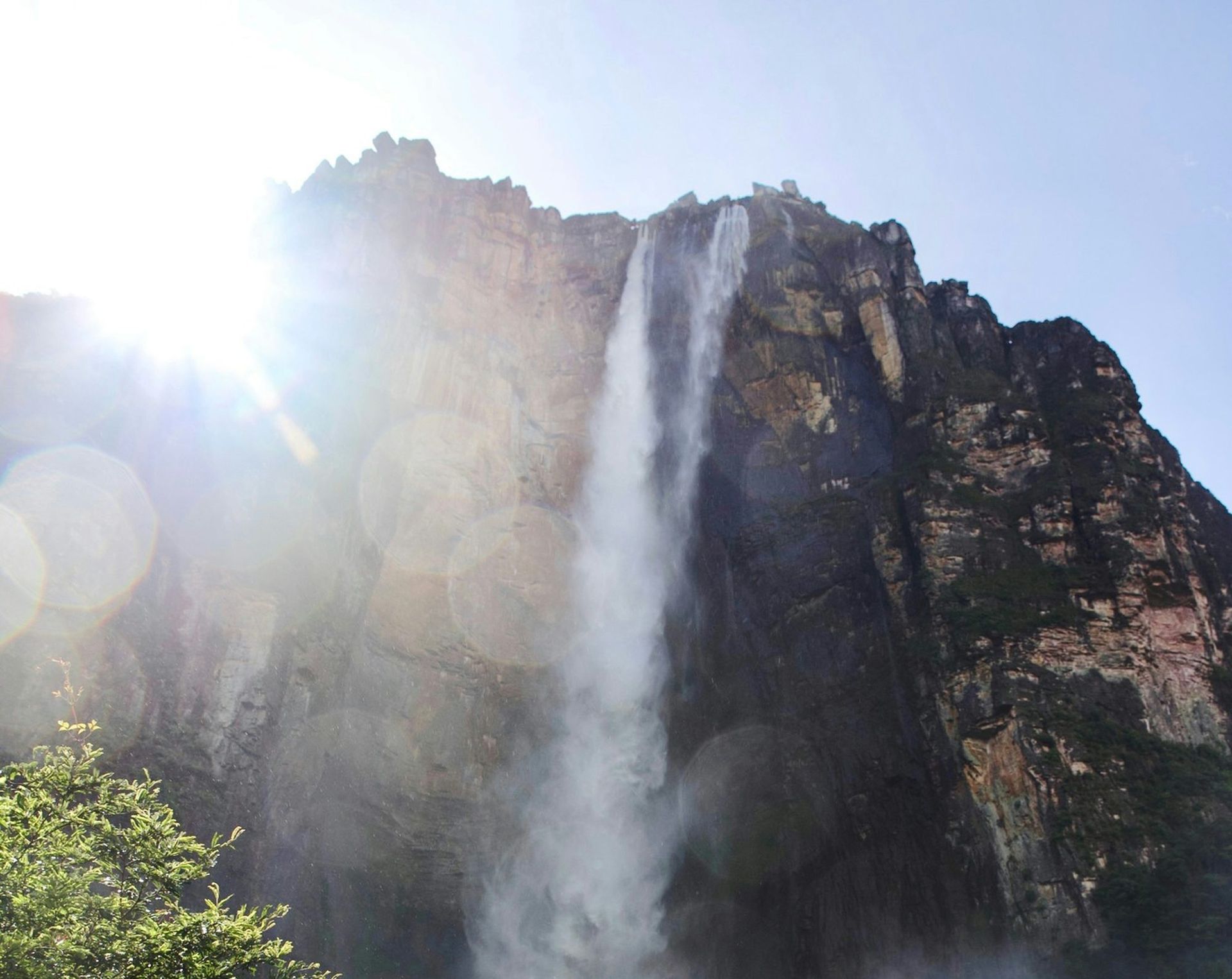 Angel Falls in Venezuela, the world's tallest uninterrupted waterfall, pouring down a sheer cliff in the sun